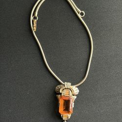 1920-30’s Art Deco-style necklace featuring a large amber-colored glass pendant 