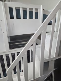 "Young kids' bunk bed with mattress