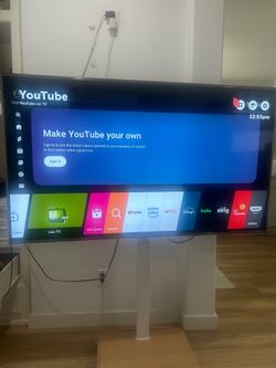 LG tv 75” with stand with wheels
