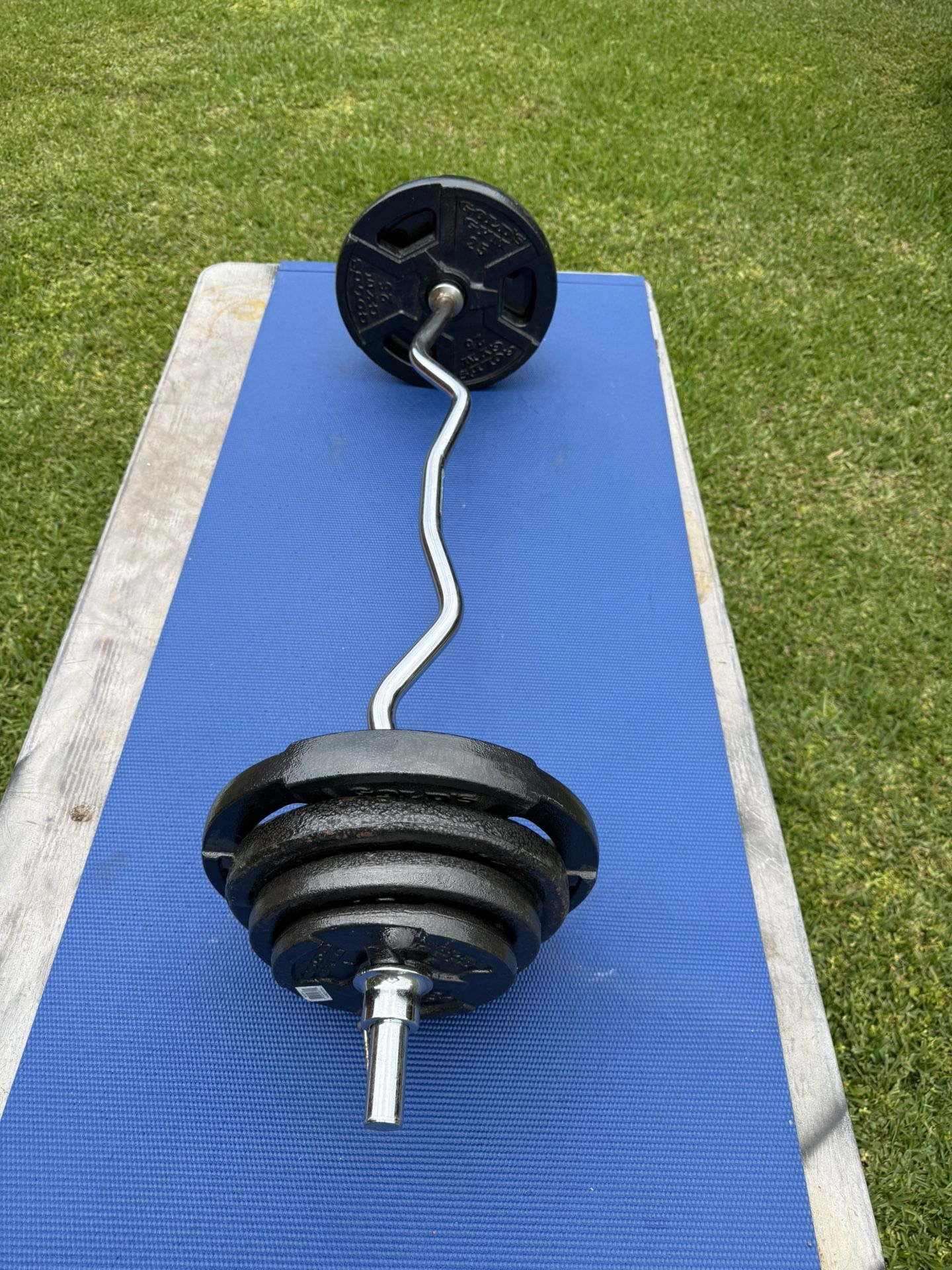 Solid Steel Curl Bar With 100 Pounds Of Standard Steel Weights