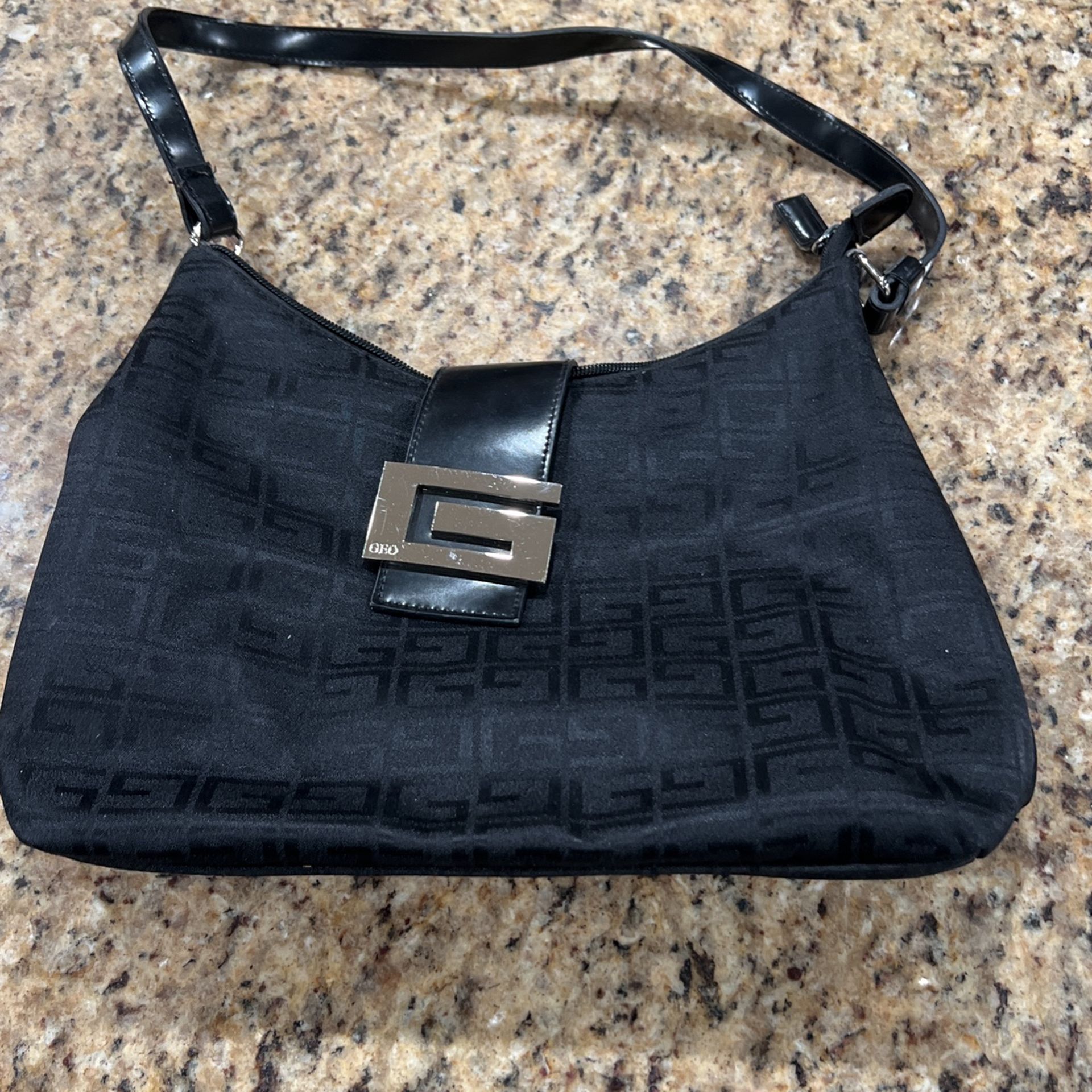 Black handbag by Geo