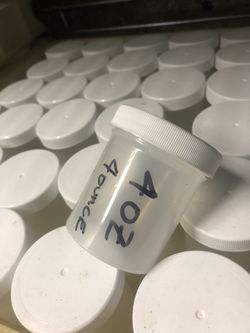 4oz wide mouth bottles with lids.