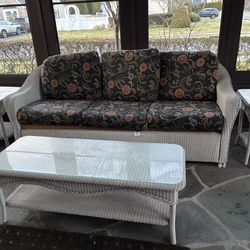 Plastic outdoor white wicker sofa, coffee table , 2 end tables (can sell separately )