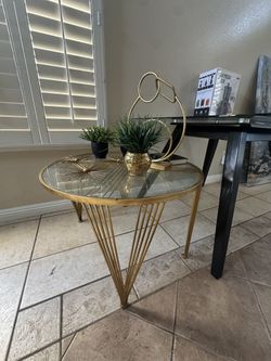 Glass top/gold trim table
