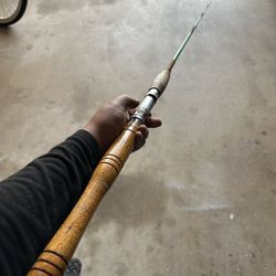 2 Green Fiberglass Fishing Rods.