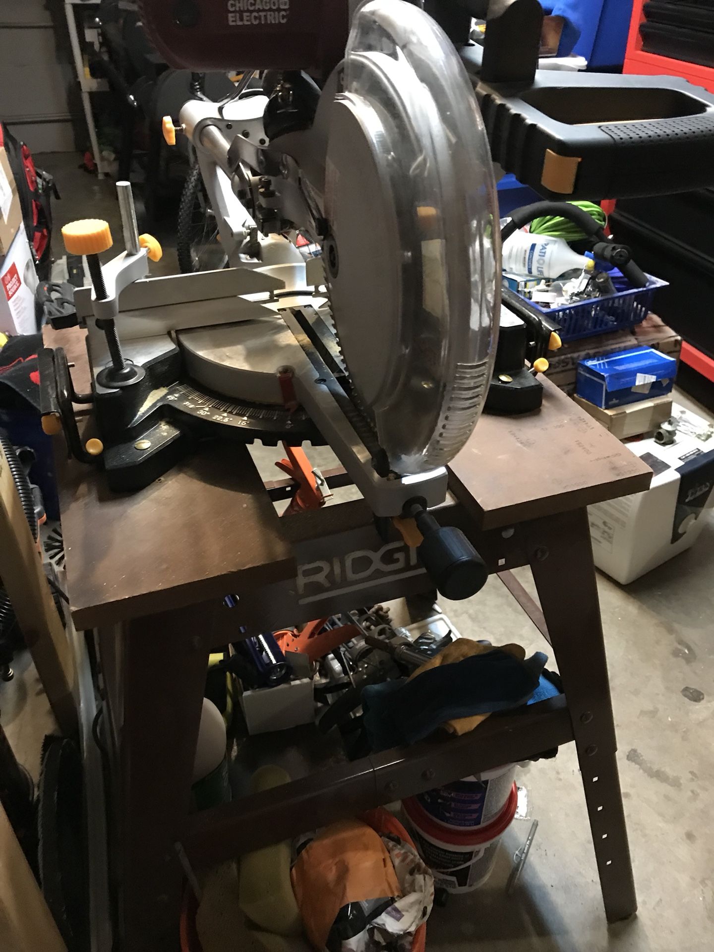 12” Chicago sliding compound saw mounted on ridgid stand.