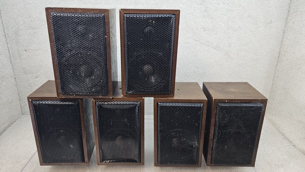 6 unbranded brown satellite or garage speakers made in Taiwan