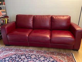 Red Leather Sofa Bed – Comfortable & Stylish!