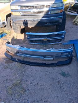 Bumper small dent and grill also two pairs of headlights