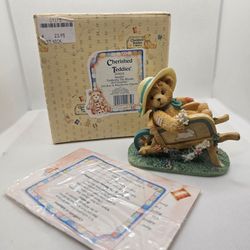 New Cherished Teddies JENNIFER flower Summer Figurine Wheelbarrow spring hat
Mint condition, kept in the box, never displayed
Girl bear in wheelbarro