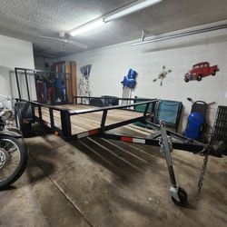 Utility trailer with ramp