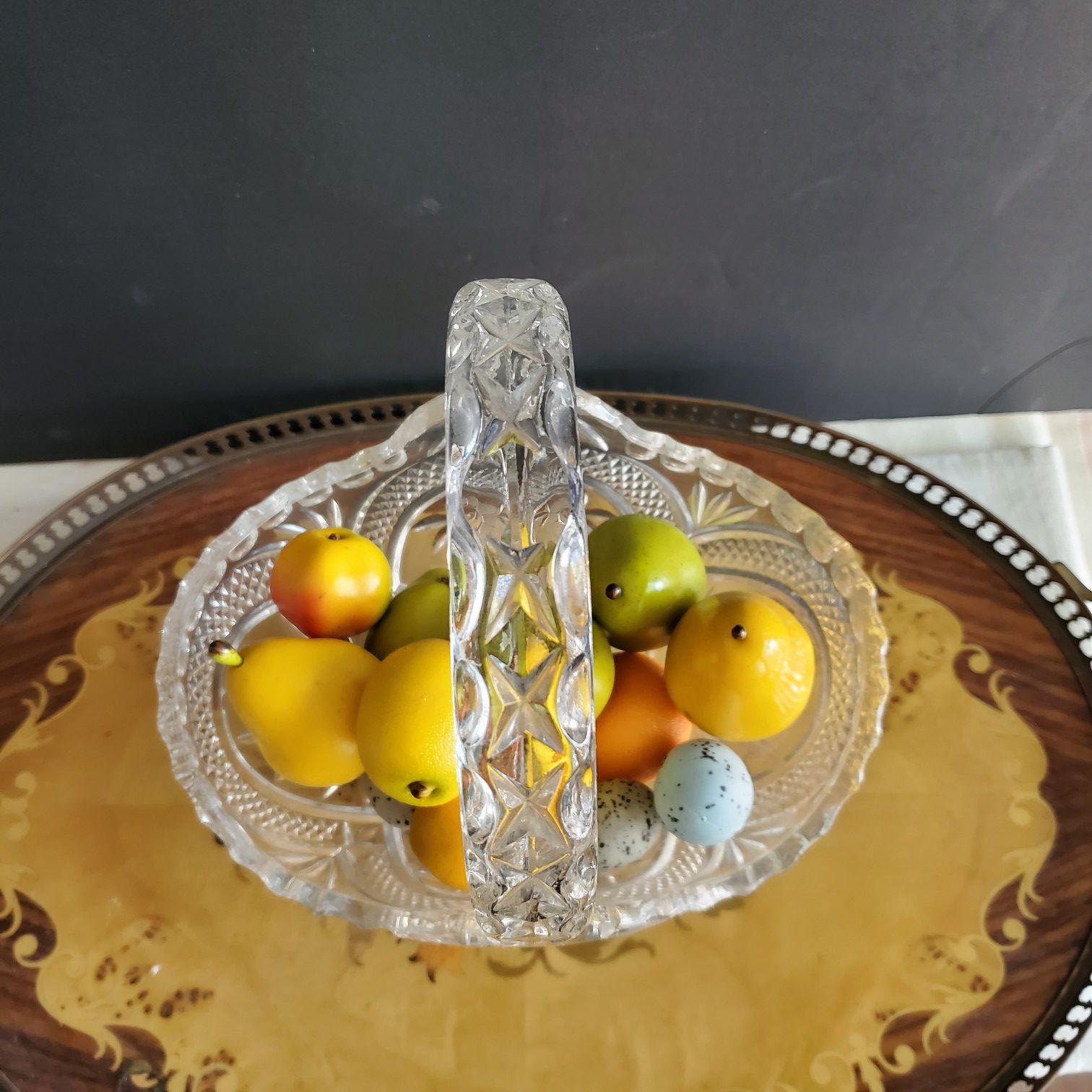 Crystal vase with fake fruits
