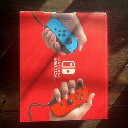 Brand New Nintendo Switch OLED – Red/Blue
