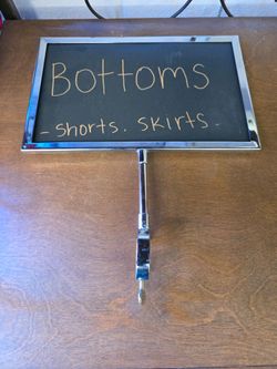 Clamp on sign for clothes fixture, $10