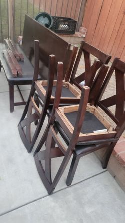 Table with 4 Chairs and Bench.