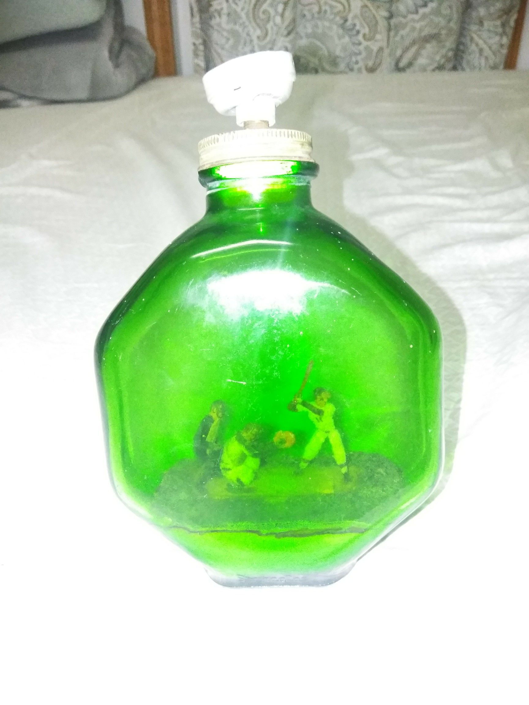 Vintage baseball player in a bottle lamp