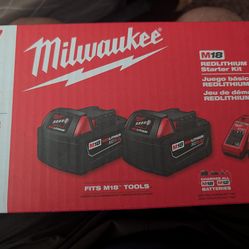 2 Milwaukee batteries and charger NEW