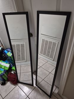 Black -framed full- length mirrors