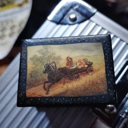 Miniature vintage Russian lacquer box featuring a traditional painted scene