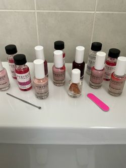 Several new bottles of nail polish/perfect formula