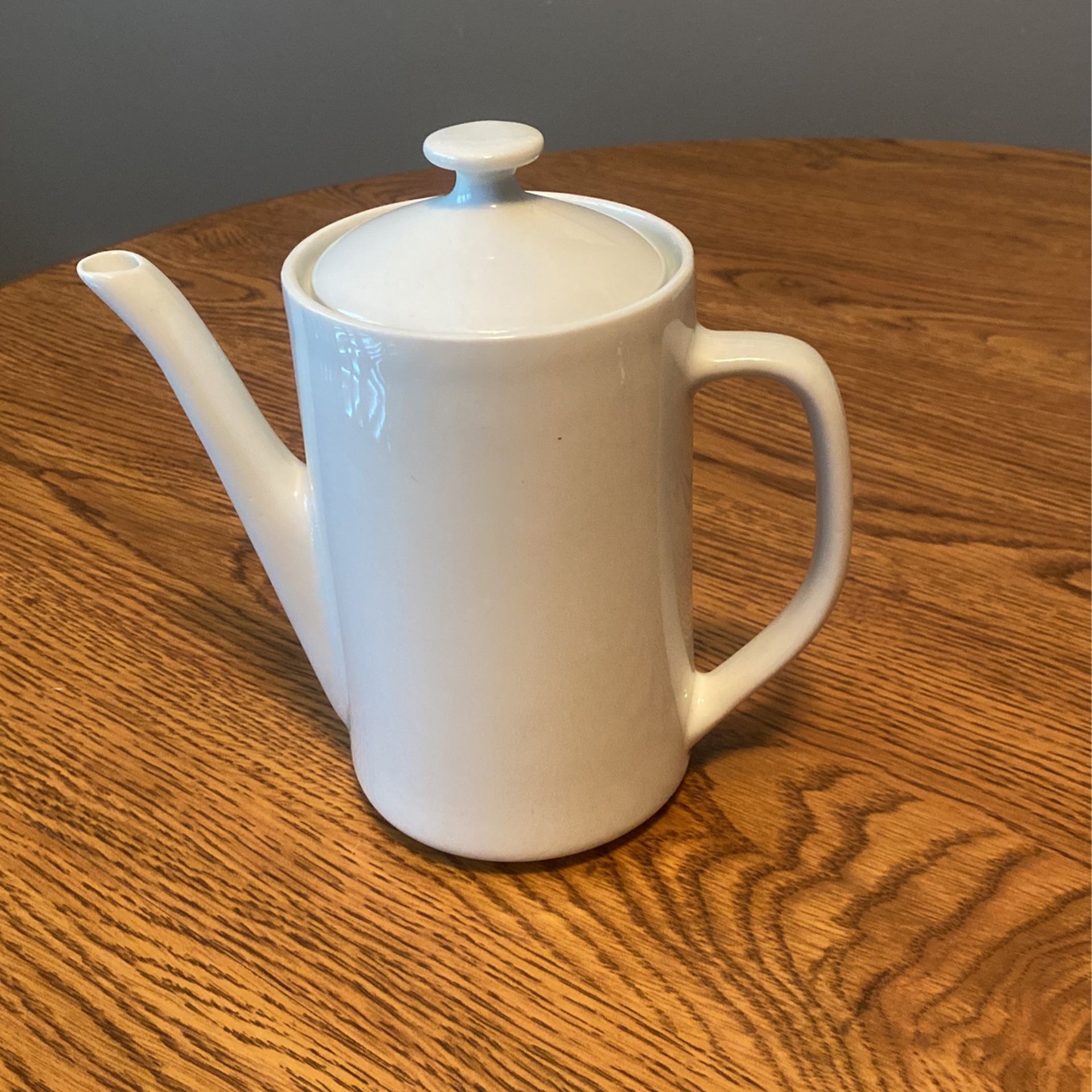 White ceramic tea pot