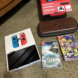 Nintendo Switch OLED Model Barely used Has everything original and PAID games