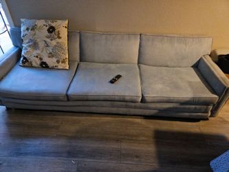 Small bed ,sofa,  and small table with lamp