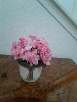 Artificial flowers in pot. $5 each