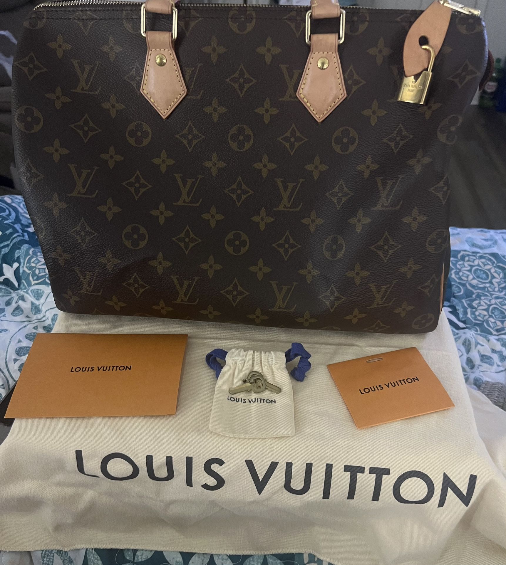 $600-Louis Vuitton