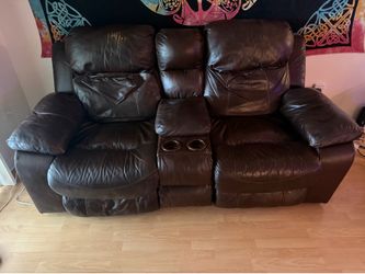Electric reclining leather couch. Free for pick up
