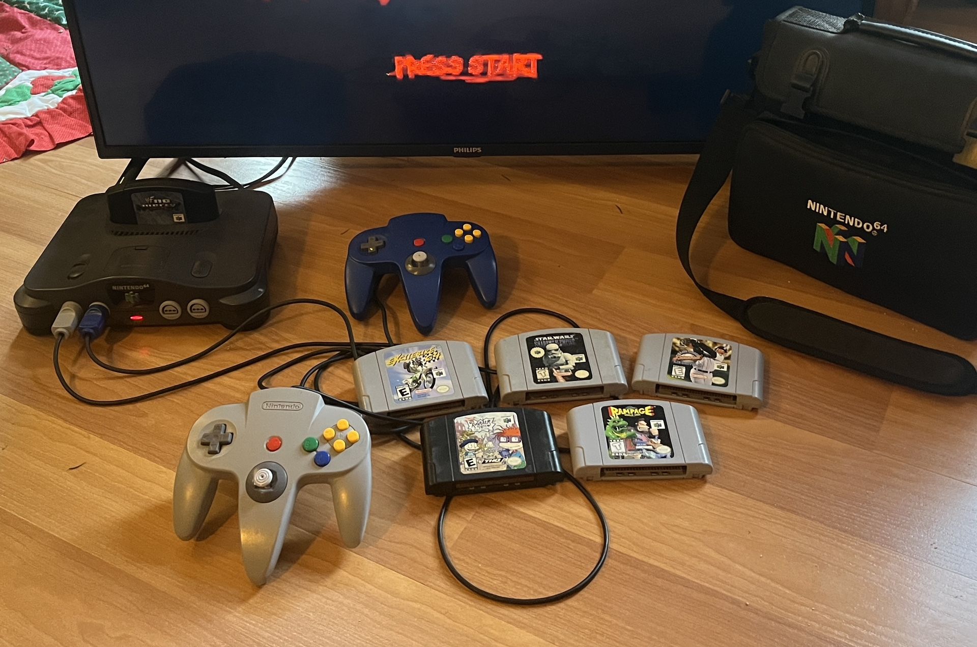 N64 Console, 2 Controllers, Carry Bag, And Games