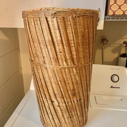 Tall, wicker entryway vase great for artificial flowers
