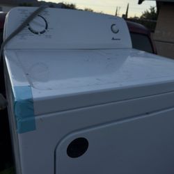 Electric Amana dryer and Winia stainless Steel refrigerator 