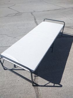 Brand new folding bed with mattress with package