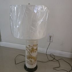 Asian-style lamp in cream and gold.