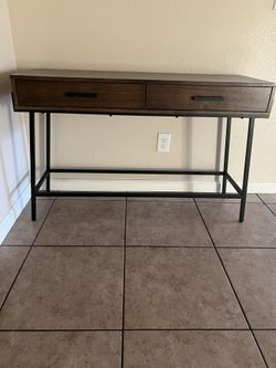 Rectangular table with two pull out drawers.