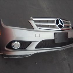 2008-2011 Mercedes Benz C250/300 Front Bumper With Grill And Emblem, Fog Lights And Amber Light With Inner Filler And Accessories Oem.