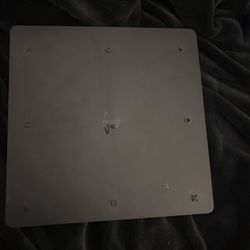 black ps4 slim with a cute little cat on it