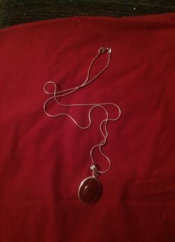 Silver chain with rusty red pendant