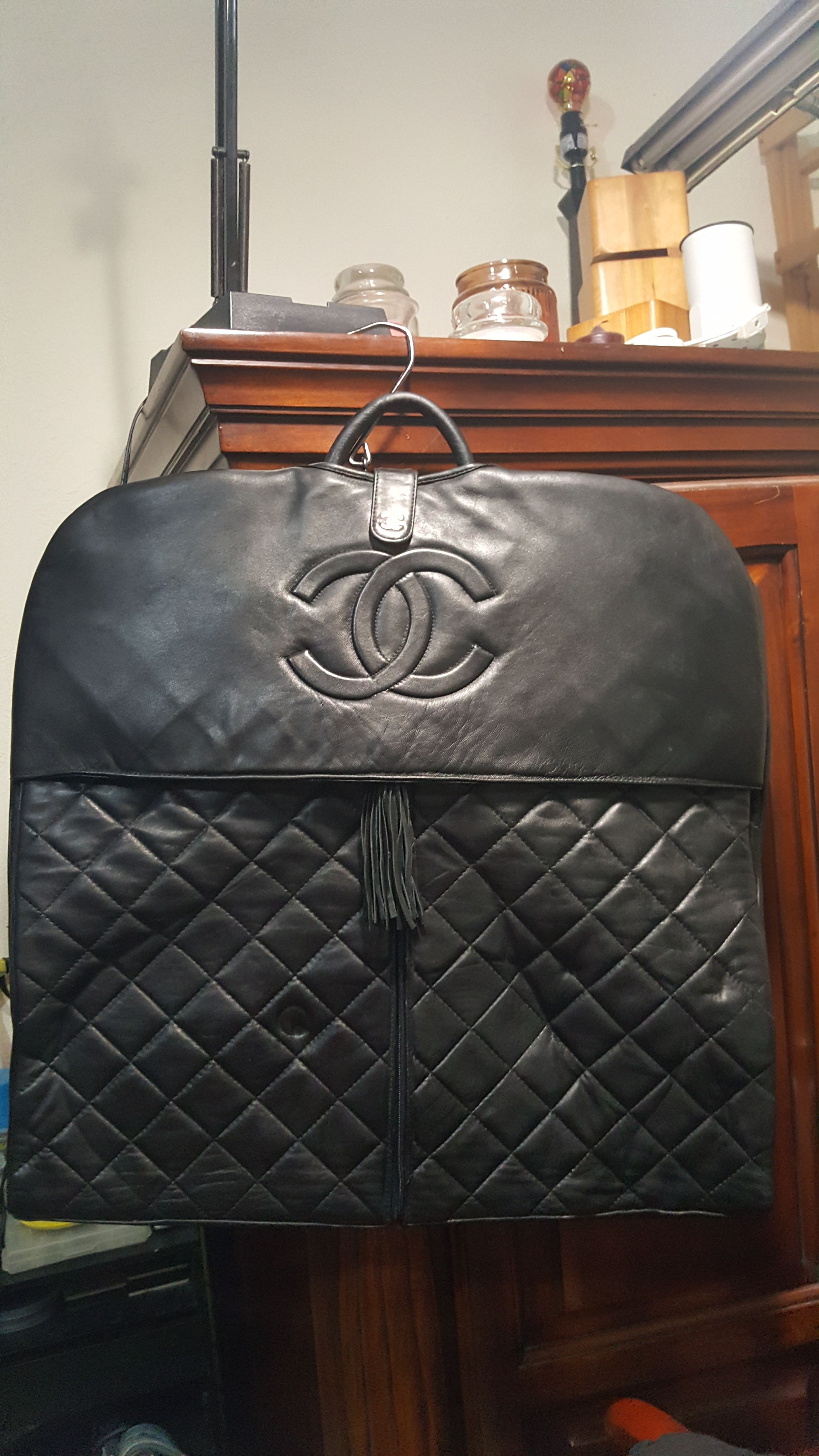 Chanel quilted garment bag