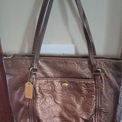 Authentic Coach Peyton shoulder bag, model number F26038, in bronze metallic embossed leather with a logo/C pattern.(Missing Shoulder Strap)