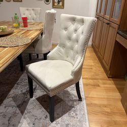 4 White upholstered Dining Chairs with nailhead trim
