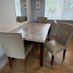 4 dining chairs, one bench and dining table all for $50