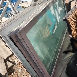 4 Glass Sliding Doors. 2 Has Wheels, 2 Does Not