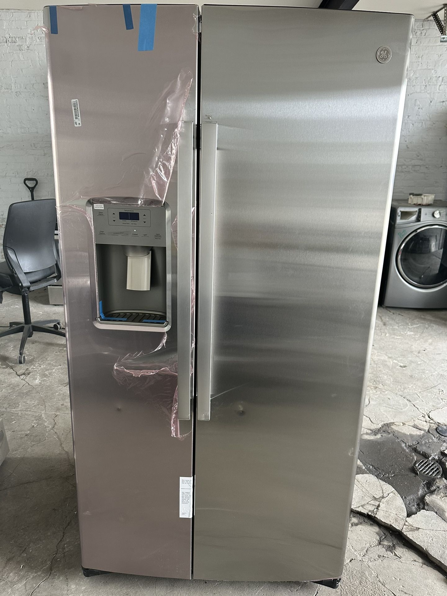GE counter depth side by side refrigerator 69” H x 36” W x 27” D.