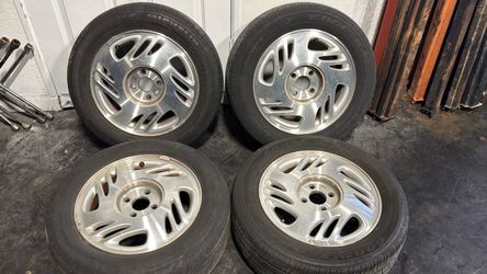 Saturn S-series 15 Inch aluminum wheels And old tires, 4x100mm Lug pattern