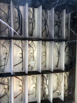 100 pairs of new sunglasses & reading glasses & revolving display stand