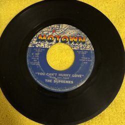This is a Motown Records 7-inch 45 RPM vinyl record single by The Supremes featuring the songs "You Can't Hurry Love" and "Put Yourself in My Place". 