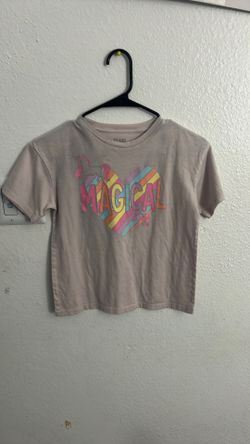 A girl shirt that says magical day