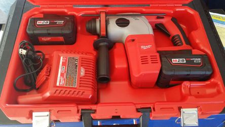 Milwaukee M 28 Hammer drill. two batteries, charger and case. Never used